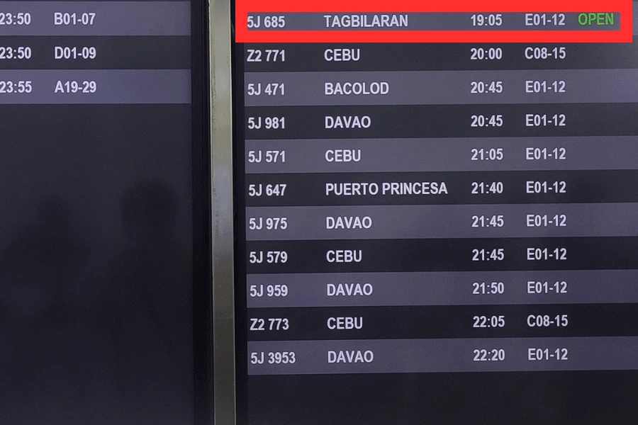 flight information display board showing a flight to bohol tagbilaran