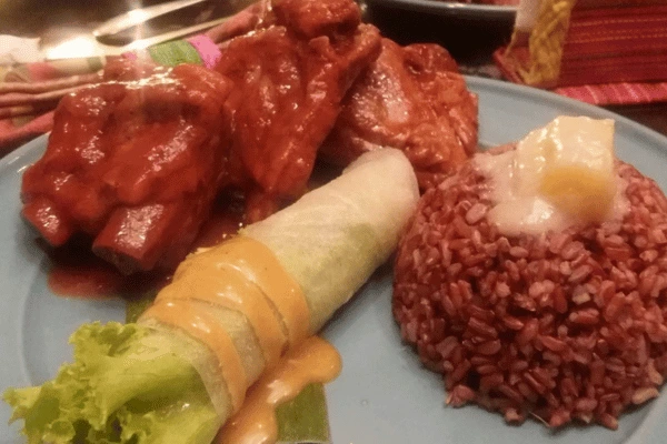 brown rice, fresh vegetables wrapped in rice paper, and a slow cooked beef in tomato sauce