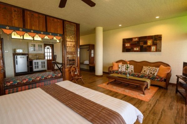 a queen size bed in a room with a rustic design