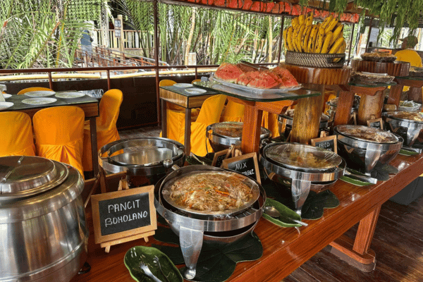 local food and delicacies like noodles with a lot of fruits all on the table
