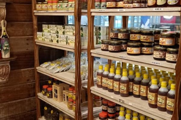 various organic products like honey, bread spreads and more, each placed in a bottle