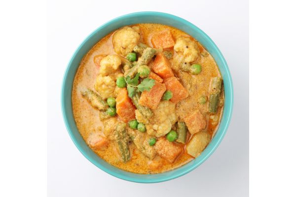 vegetable curry with light yellow sauce in a bowl