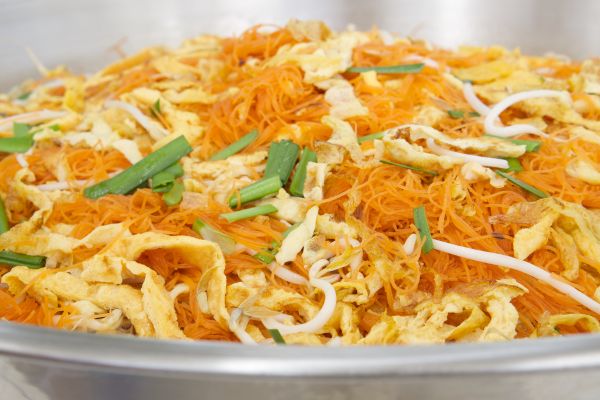 pancit or asian noodles sauted with vegetables like string beans and cabbage