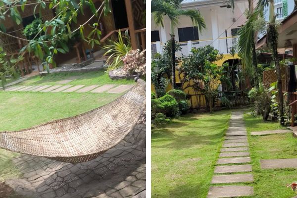 accommodation fron yard with short green grass and a hammock