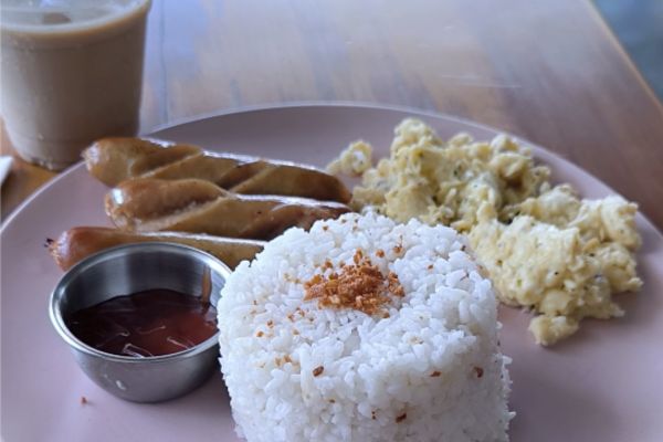 garlic rice, sausage, scrambled egg, dipping sauce, a cup of coffee, a simple breakfast
