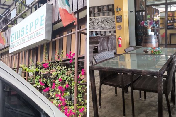 restaurant signage on the left saying giuseppe pizzeria and the cozy inside with a set of brown table and chairs
