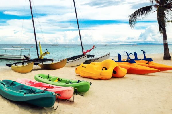 banana boats and kayak on the beach near the sea