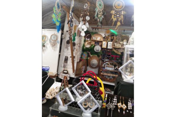 alona beach shop selling different kinds of crafts